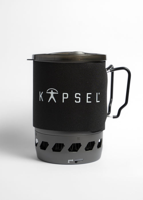 Black KAPSEL 1.1L Compact Gas Stove with handle on a white background