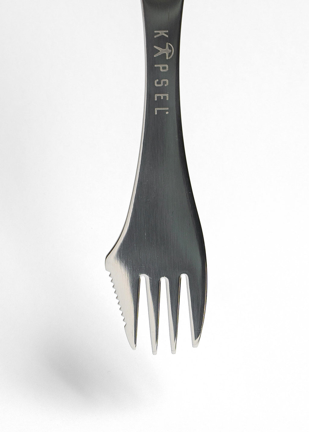 Metallic spork with 'Kapsel' branding on a white background