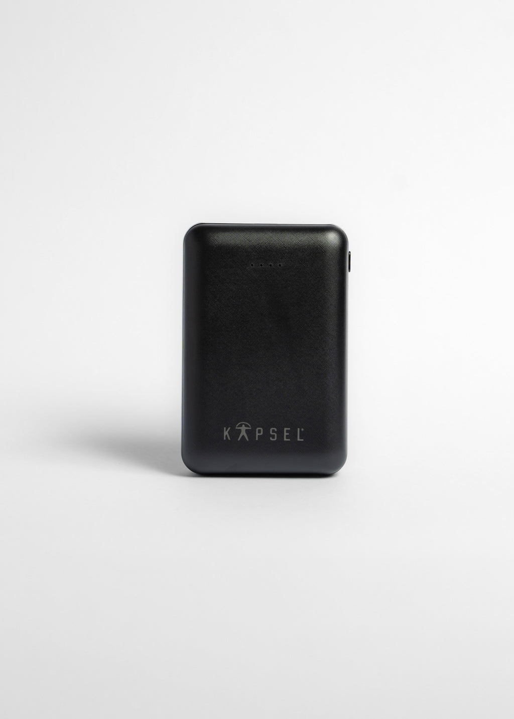 Black power bank with 'KAPSEL' branding on a white background