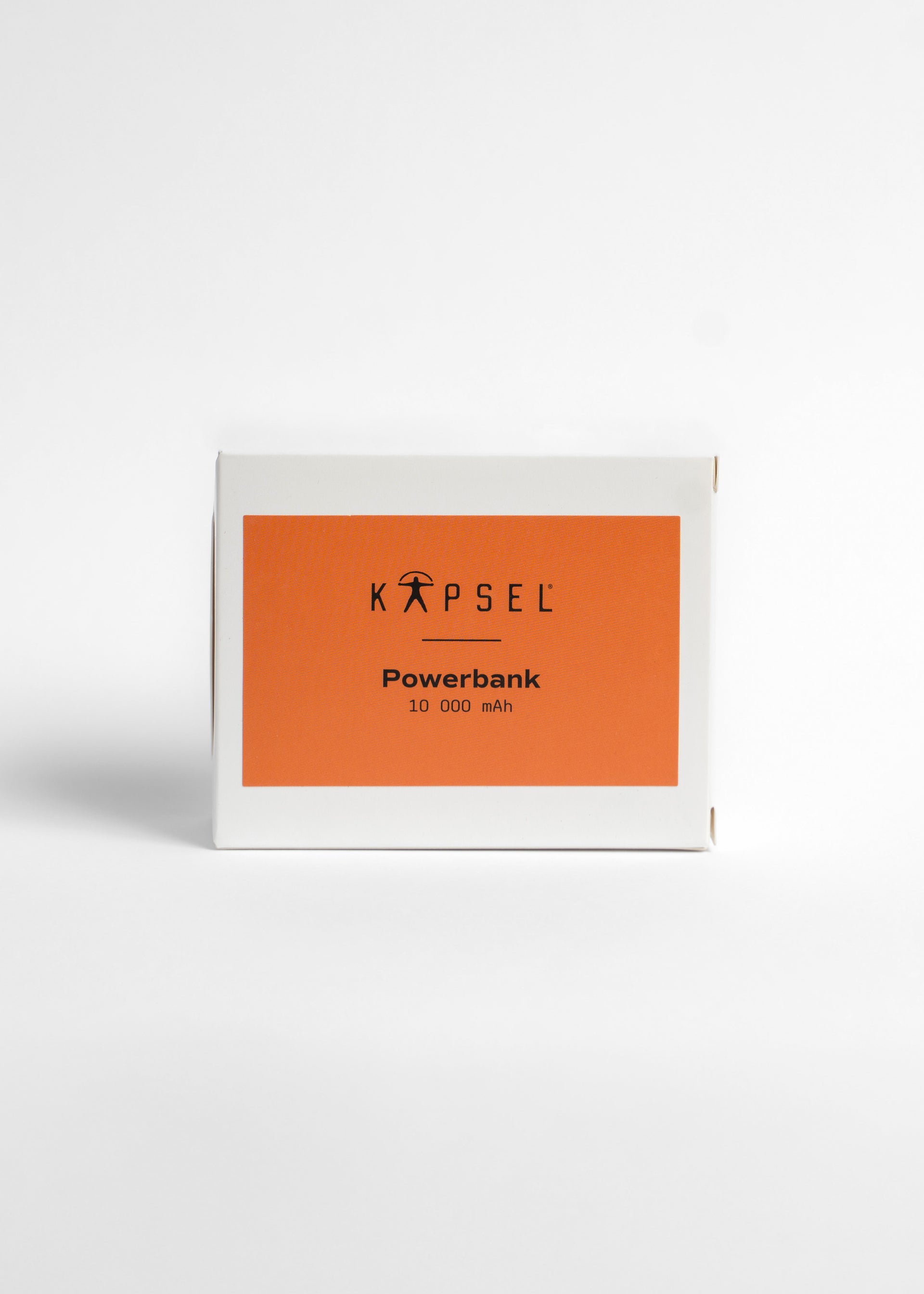 Kapsel powerbank packaging with orange label on a white background