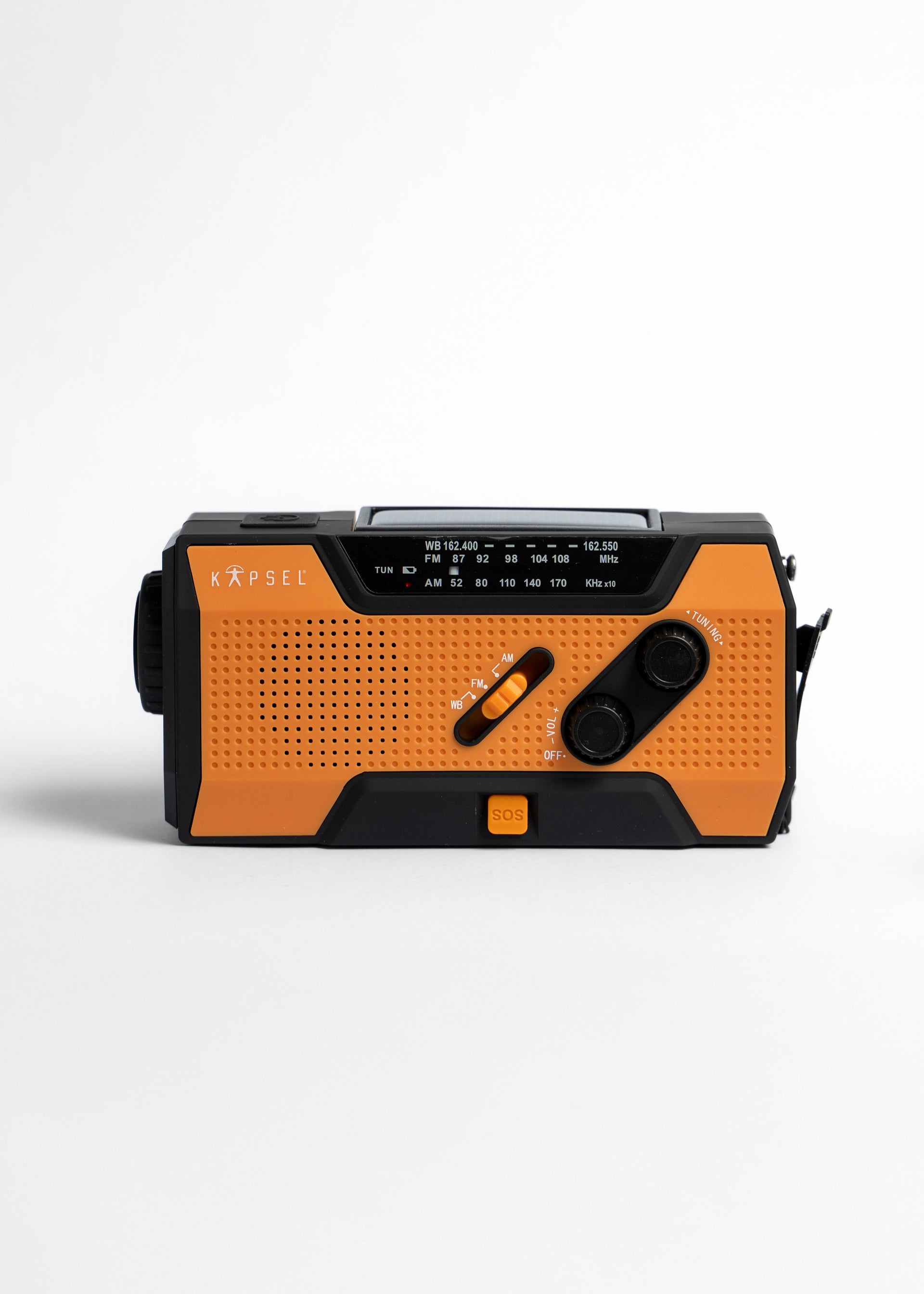 Orange and black portable solar crank radio on a white background