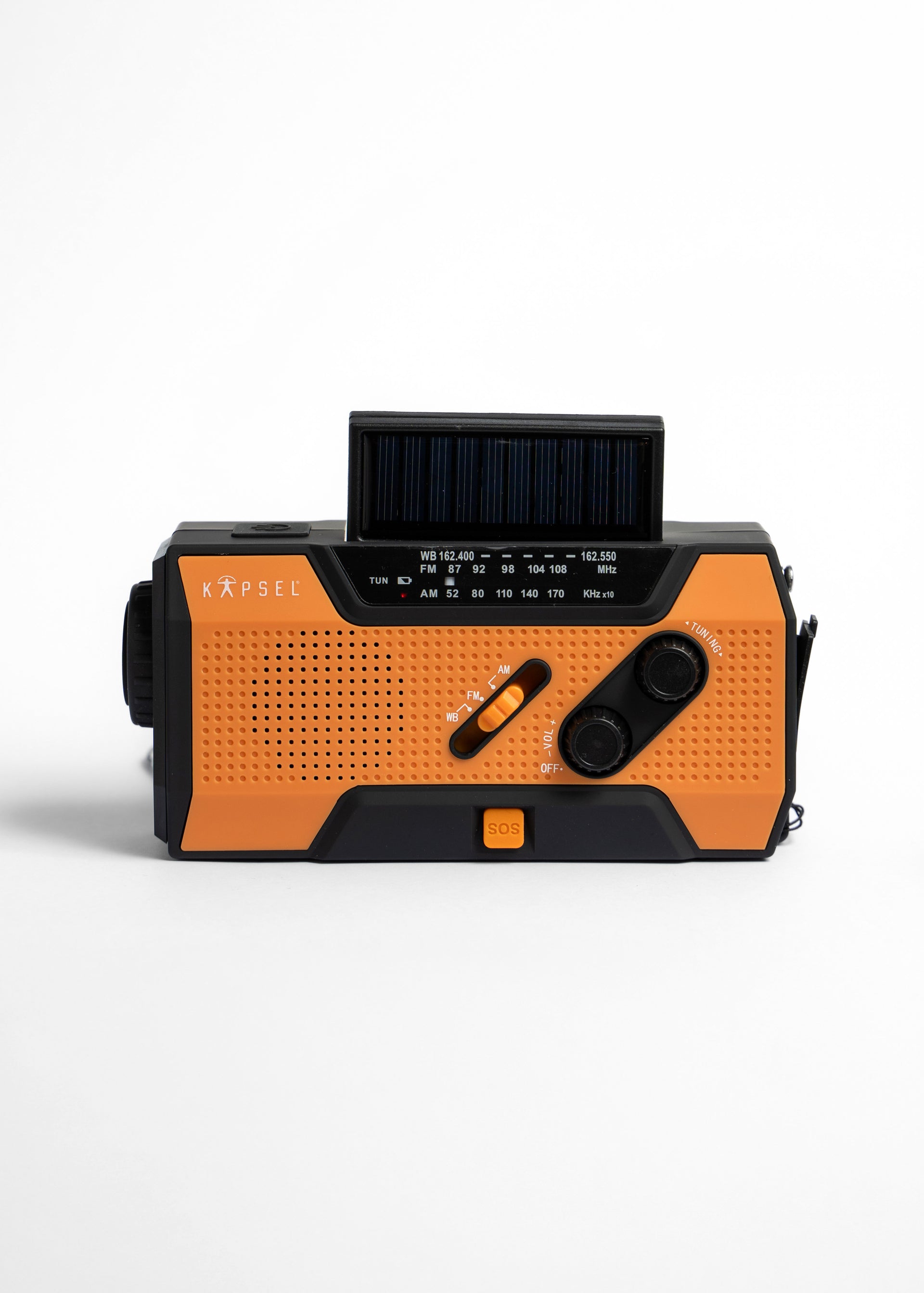 Orange and black crank radio with solar panel on a white background