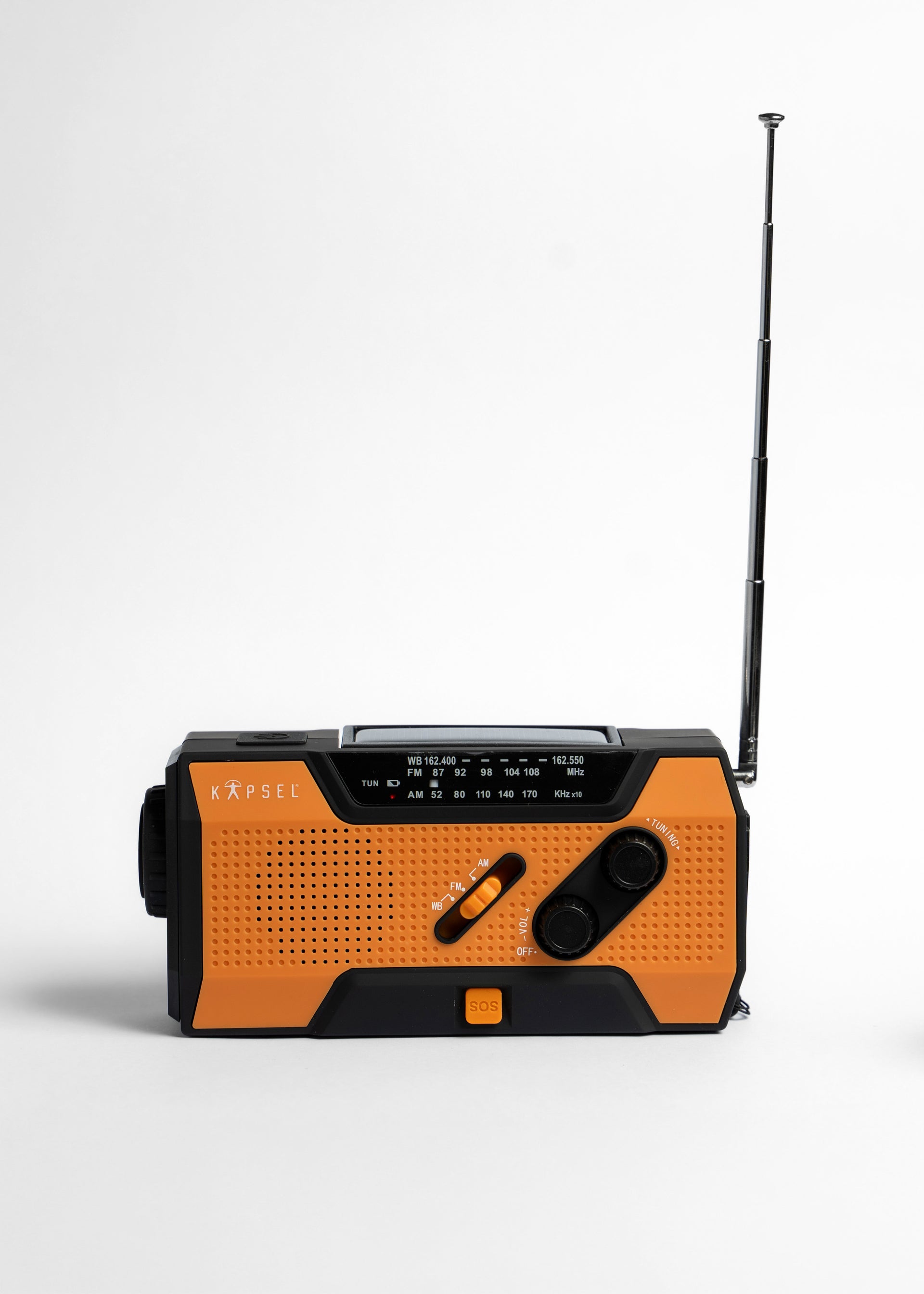Orange and black radio with antenna on a white background